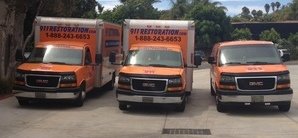 Mold Removal Van And Trucks At Commerical Job Location